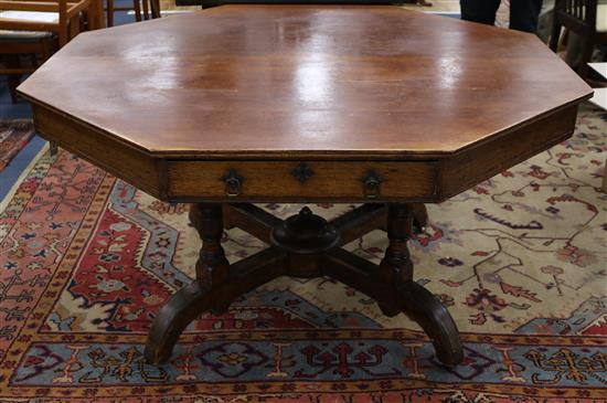 An octagonal Gillows oak library table W.137cm